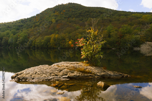 Fall landscape on the forest lake.