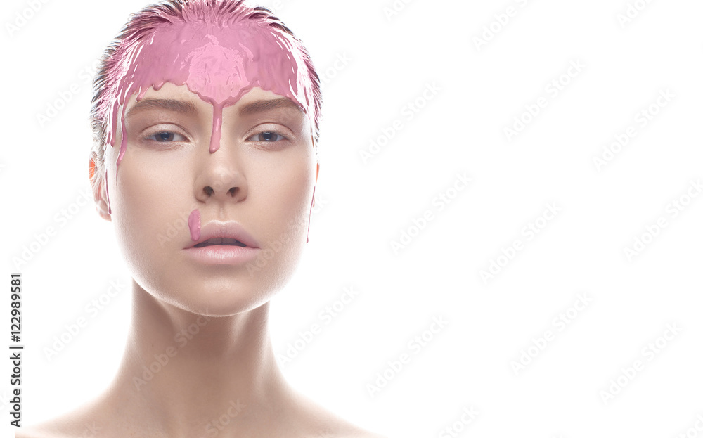 Beautiful girl with a creative clay makeup. Beauty face. Model with foundation on her face