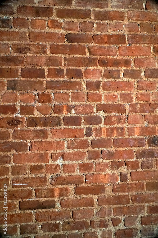 Obraz premium Red brick wall pattern. Interior construction design creates modern urban feel for home living. Vertical framing