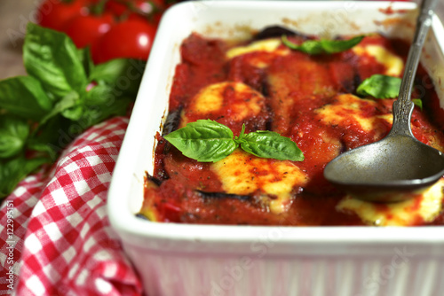 Traditional italian dish parmigiana with eggplants.