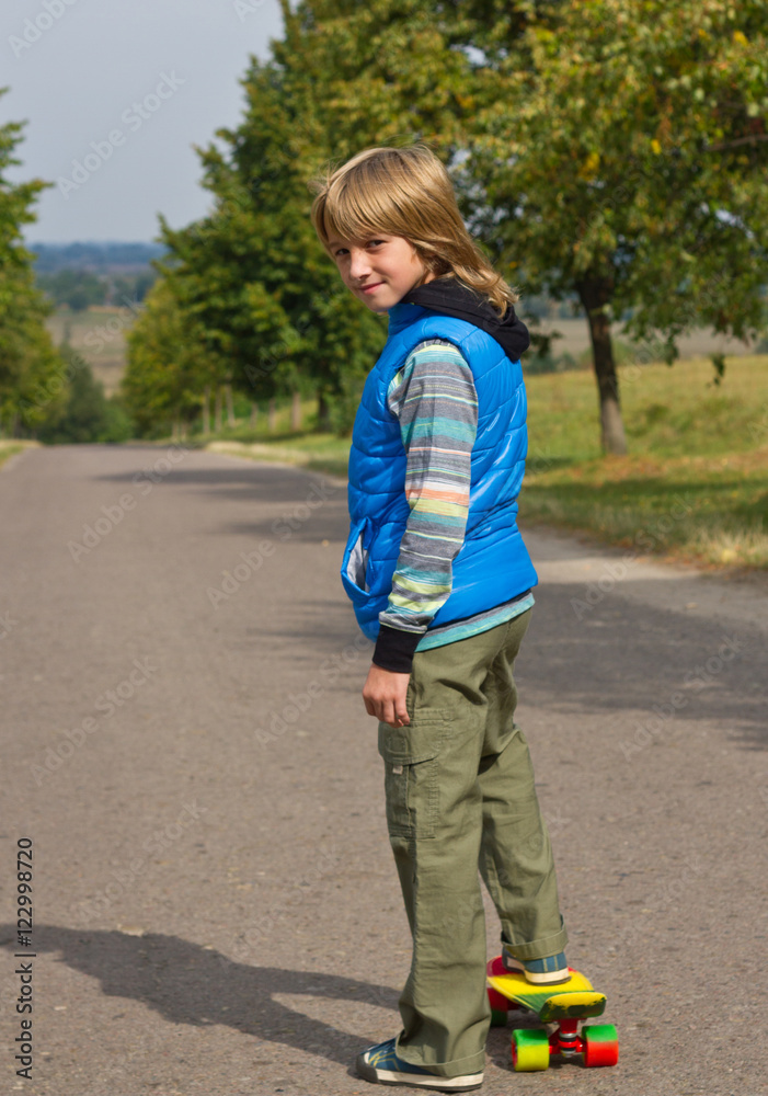 Full-length portrait of cool little boy with skateboard Full-length portrait of cool little boy with skateboard