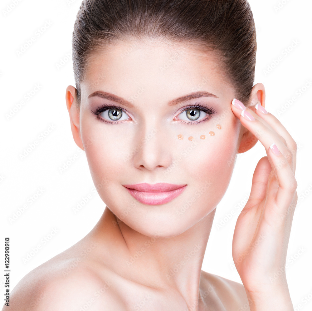 Beautiful face of young woman with cosmetic foundation on a skin Beautiful face of young woman with cosmetic foundation on a skin