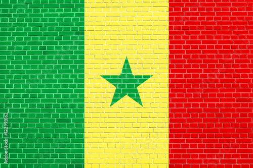 Flag of Senegal on brick wall texture background