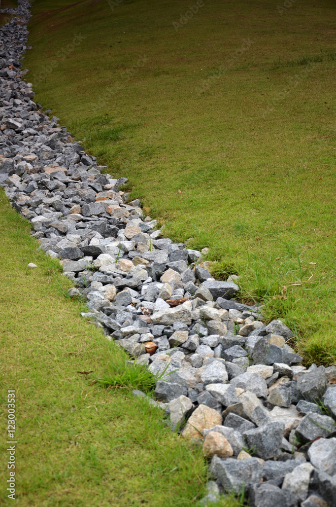 Obraz premium Stone and green grass