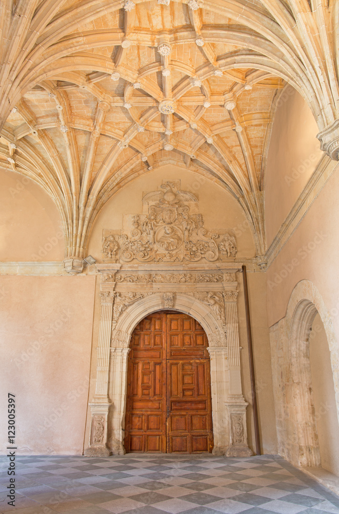 SALAMANCA, SPAIN, APRIL - 16, 2016: The gothic archs of atrium and baroque portal of monastery Convento de San Esteban.