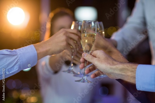 Group of businesspeople toasting glasses of champagne
