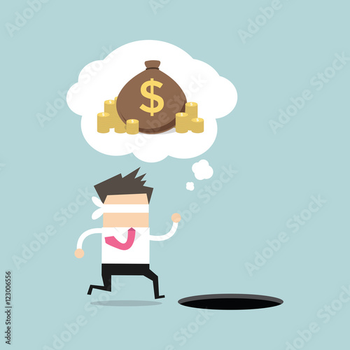 Blindfolded businessman running to find money with pit hole.