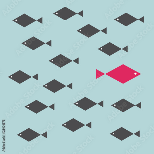 One red unique different fish swimming opposite way of identical black ones. Courage, confidence, success, crowd and creativity concept.