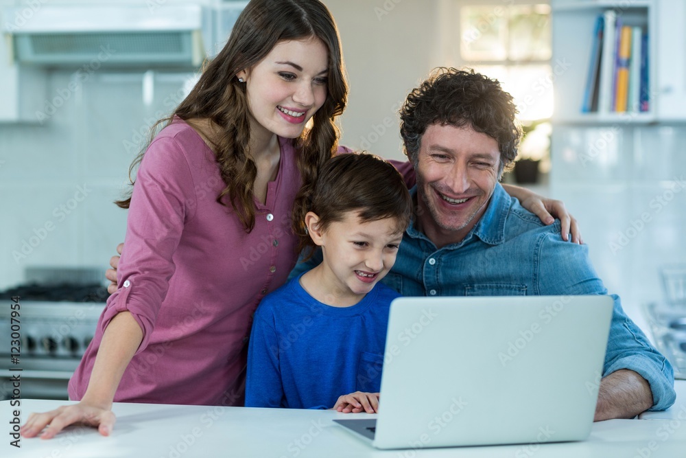 Happy family using laptop Happy family using laptop