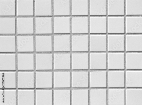 White brick tile wall seamless background and texture..