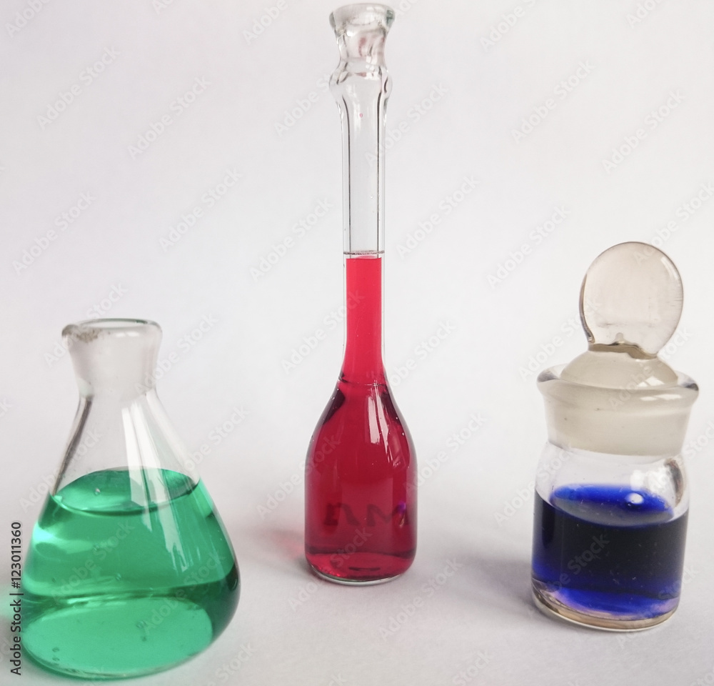 Set of glassware filled by solutions of different chemicals Set of glassware filled by solutions of different chemicals