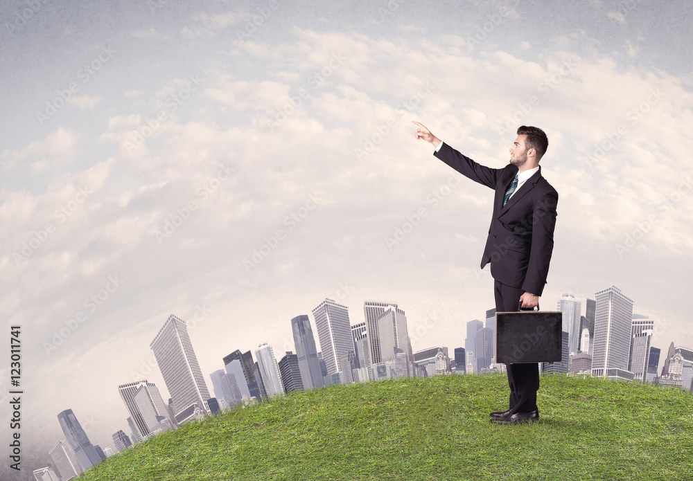 man standing in front of city landscape man standing in front of city landscape