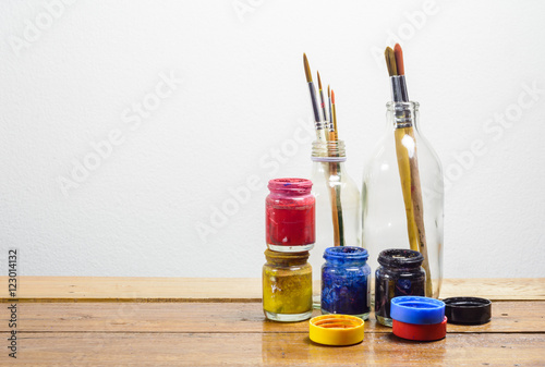 Brush paints on wood table