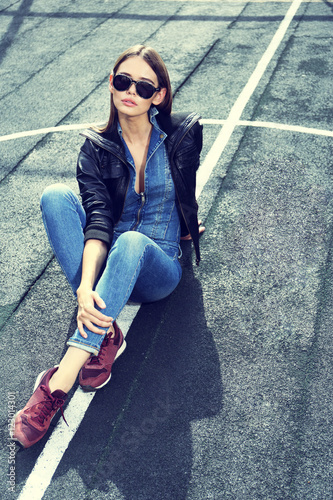 young stylish hipster woman outdoor, wearing sunglasses