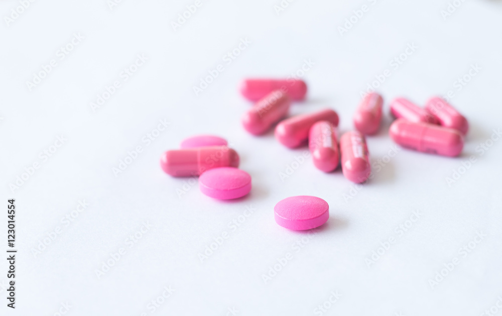 pink pills on white