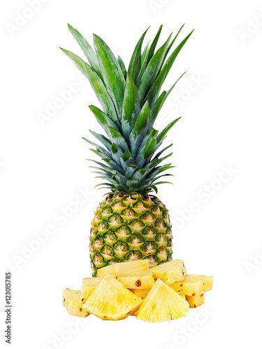 Ripe whole pineapple with slices isolated on white background. Closeup.