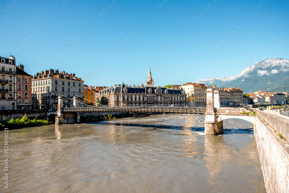 Morning cityscape view with mountains, river and bridge in Grenoble city on the south-east of France