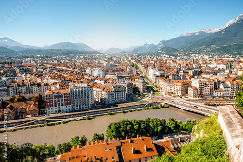 Morning cityscape view on the old town with mountains and river in Grenoble city on the south-east of France photo