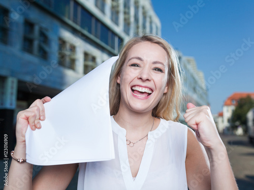 business woman with accepted papers or application photo