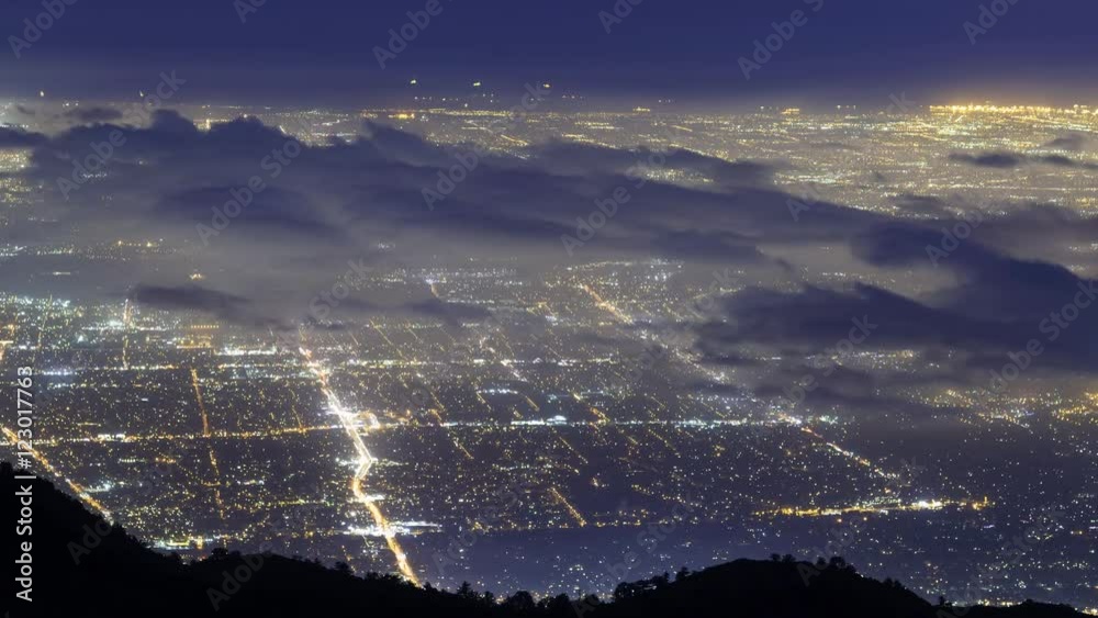 Time lapse of aerial view of foggy Los Angeles city lights shot from Mt. Wilson, California -Long Shot-