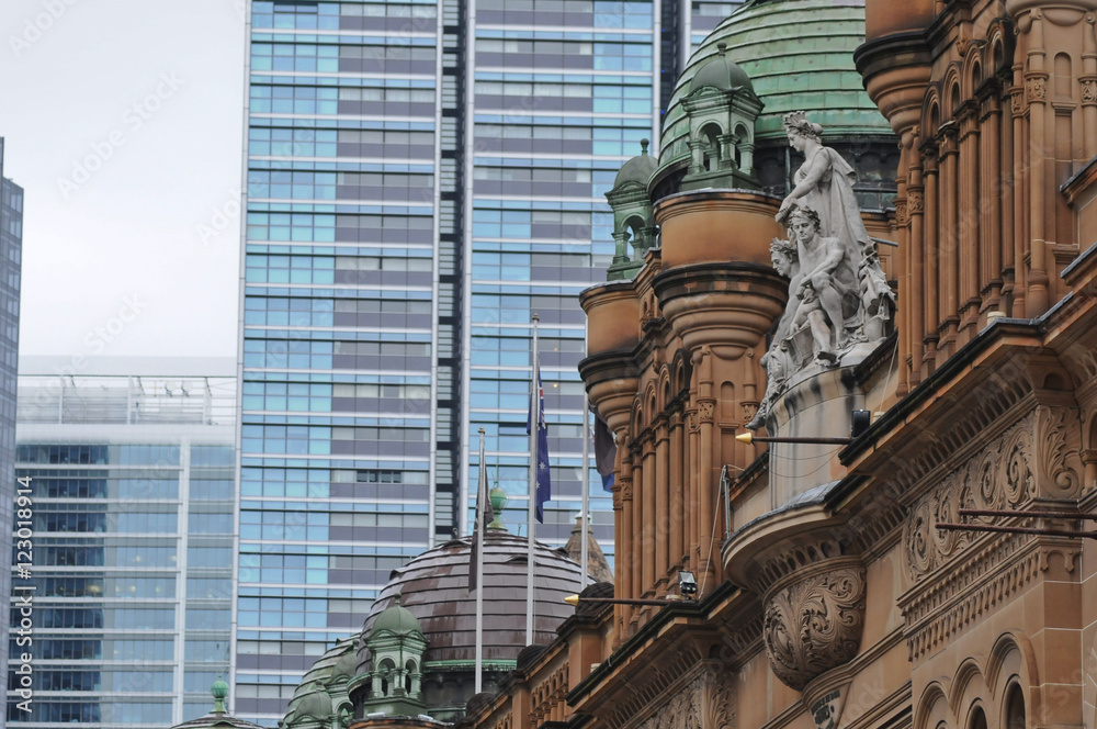 Obraz premium Old QVB Building in Sydney among high rise apartments