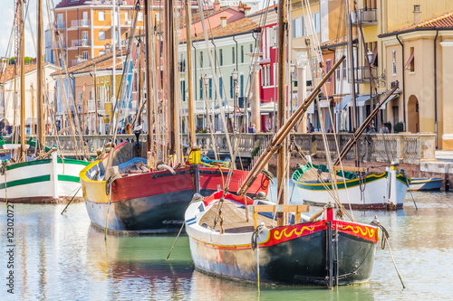 Antique fishing boats in harbor channel © Vivida Photo PC