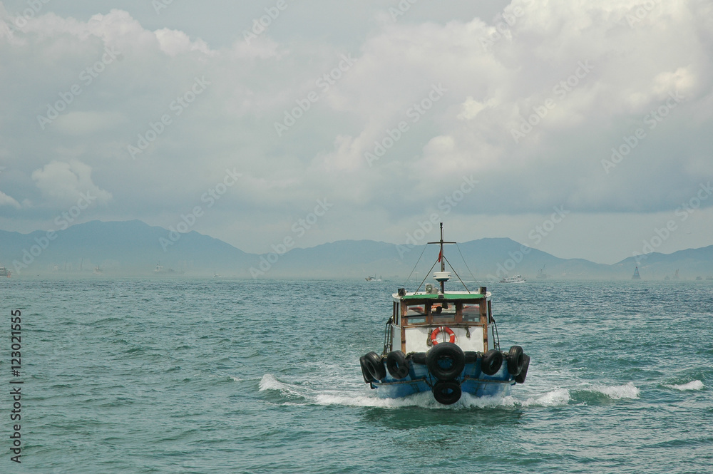 Motor ferry sailing in Hong Kong bay Motor ferry sailing in Hong Kong bay