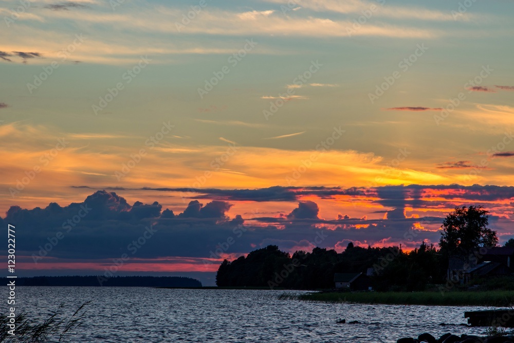 Beautiful tranquil summer sunset on the Onega lake, Karelia, Russia