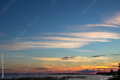Beautiful tranquil summer sunset on the Onega lake, Karelia, Russia