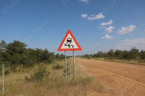 Traffic sign Danger of skidding in the wet or dirt, Namibia Africa