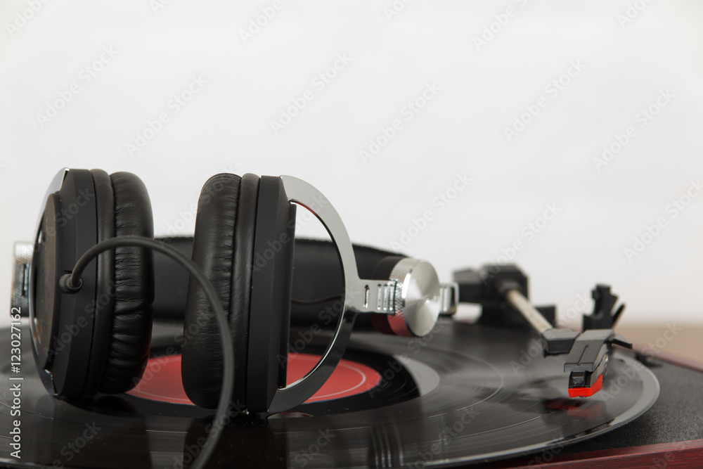Headphones on an old retro record player Headphones on an old retro record player