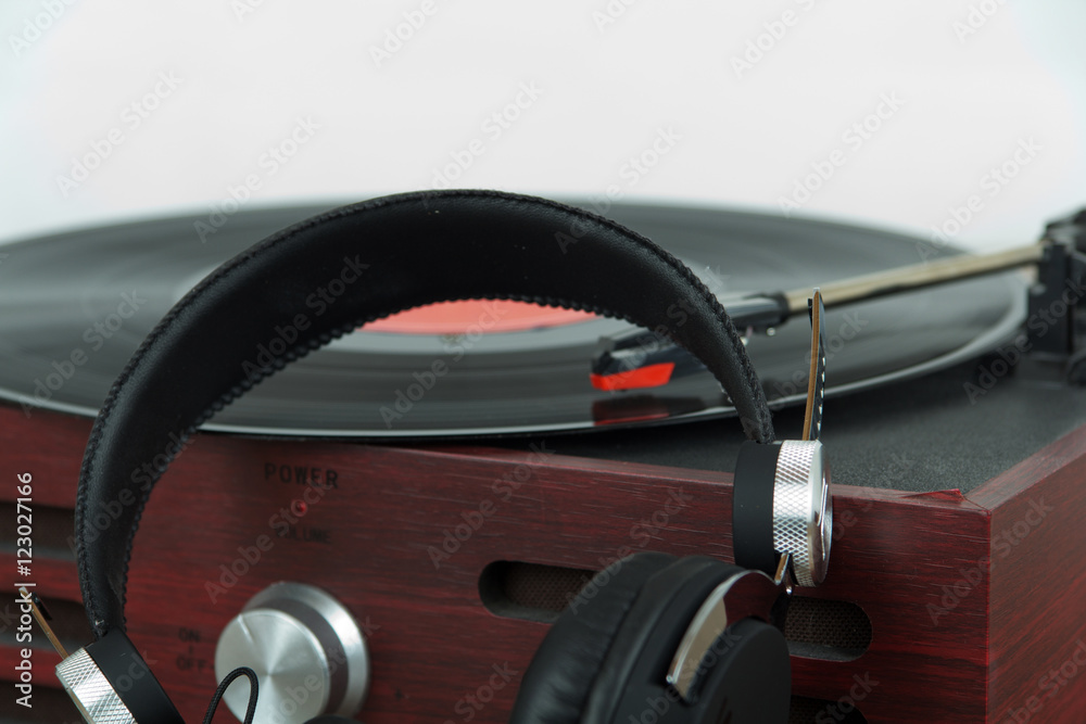 Headphones on an old retro record player Headphones on an old retro record player