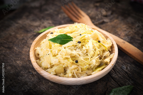 Steamed sauerkraut on old wooden background