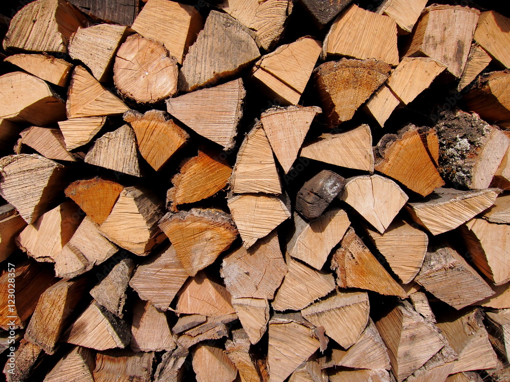 Pile of chopped fire wood prepared for winter. Texture Pile of chopped fire wood prepared for winter. Texture