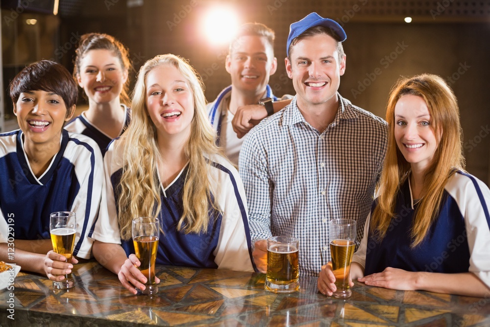 Group of friends having glass of beer in party Group of friends having glass of beer in party