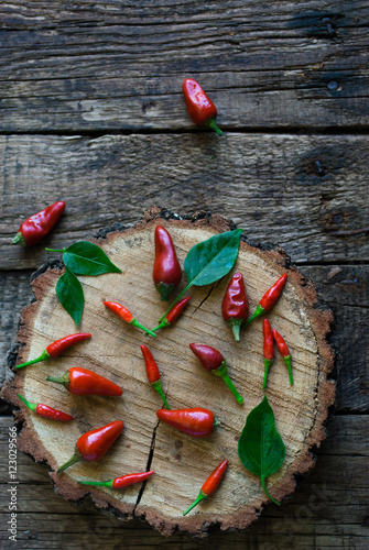 Little Red Peppers on a Wooden Background