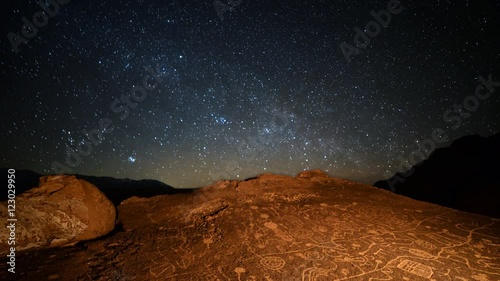 Astrophotography Time Lapse of starry sky over Native American petroglyphs in Eastern Sierra, California -More Sky- photo