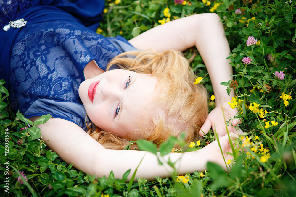 Portrait of beautiful little girl in the blue dress on the nature Portrait of beautiful little girl in the blue dress on the nature