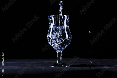 Portrait of the fault of the glasses of water on a black background