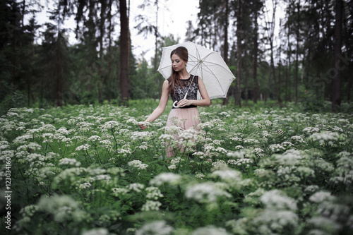 Wallpaper Mural Portrait of beautiful girl with umbrella in nature and white flowers Torontodigital.ca