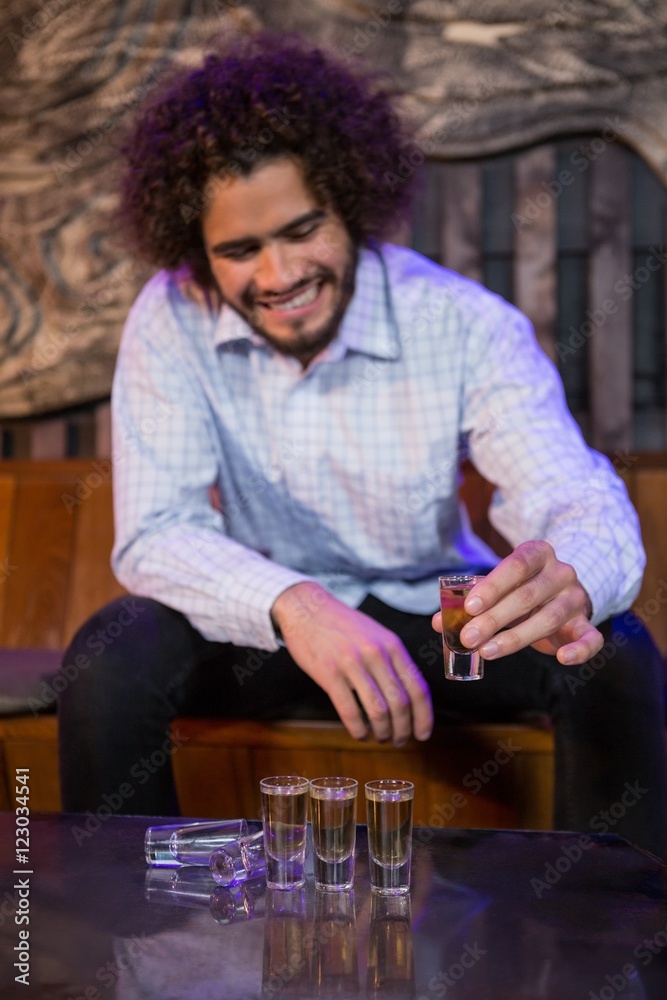 Man having a tequila in bar Man having a tequila in bar