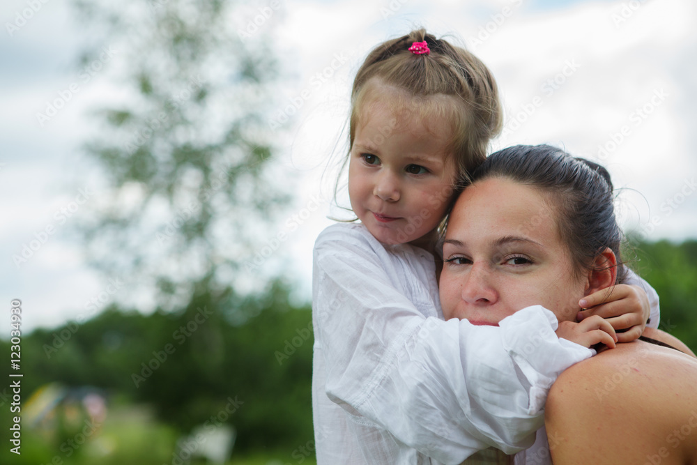 Portrait of mother and daughter outdoors forest river grass Portrait of mother and daughter outdoors forest river grass