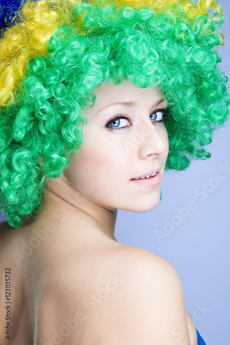 Portrait of a beautiful young girl in a wig