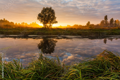 Fototapeta Naklejka Na Ścianę i Meble -  Colorful sunset over the beautiful little river