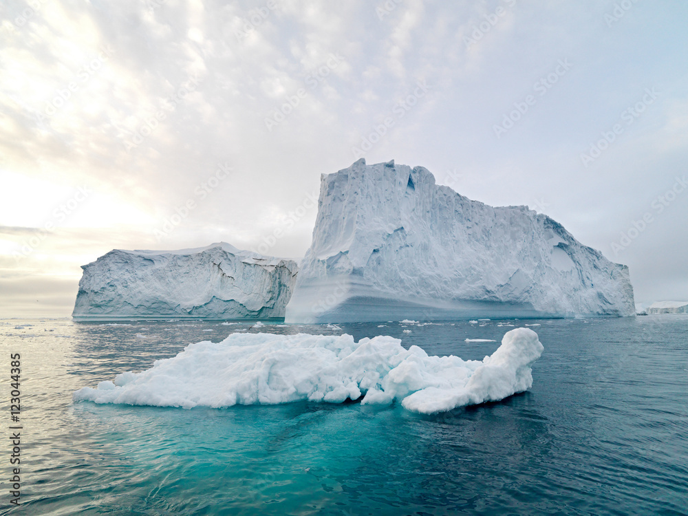 Icebergs on arctic ocean in Ilulissat icefjord, Greenland Icebergs on arctic ocean in Ilulissat icefjord, Greenland
