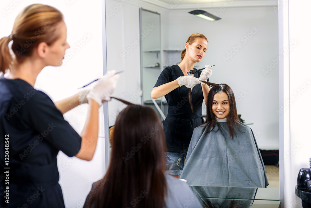 barber working with her client barber working with her client
