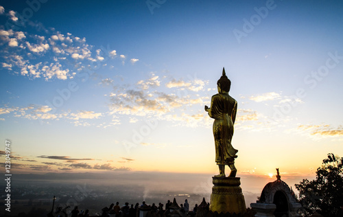 Big Buddha statue on sunrise sky