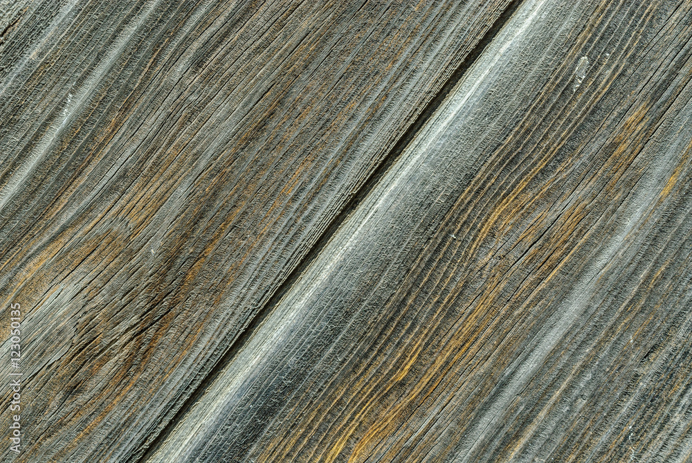 Fototapeta premium texture of a plank of gray wood, worn out with a crack in way