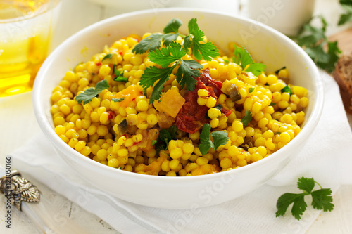 Bulgur with pumpkin, mushrooms and tomatoes.