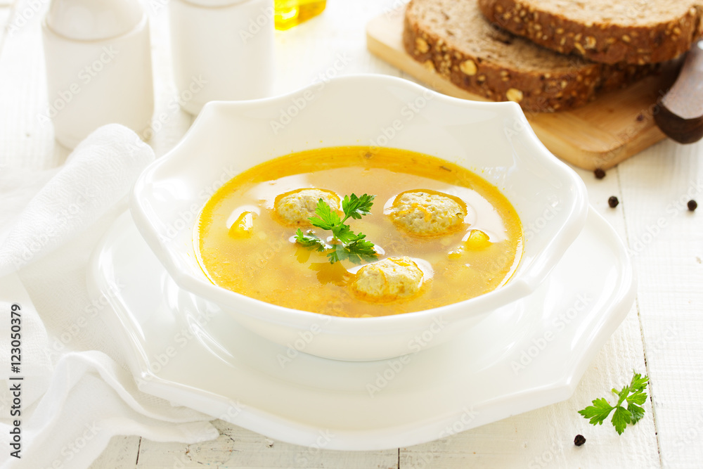 Homemade soup with chicken meatballs.
